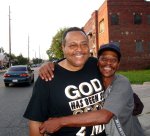 Rev. Robert Hayes, Jr. with a member of the community at the Tent Revival
